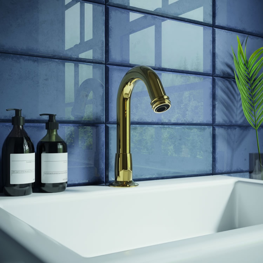Lifestyle image of Crosswater Belgravia Sensor Basin Deck-Mounted Spout Unlacquered Brass mounted on white basin against blue tiles..